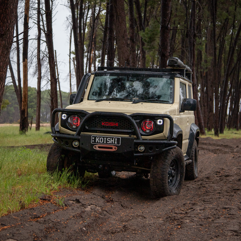 Koishi_The_Jimny JB74 Suzuki Jimny parked in moody forrest with red halo headlights